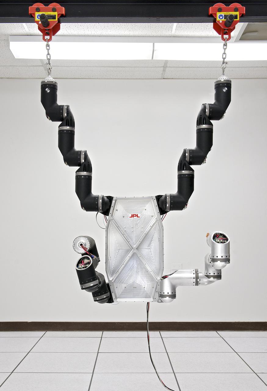 This photograph shows RoboSimian, a disaster-relief and -mitigation robot, under construction in a lab at NASA Jet Propulsion Laboratory, Pasadena, Calif.