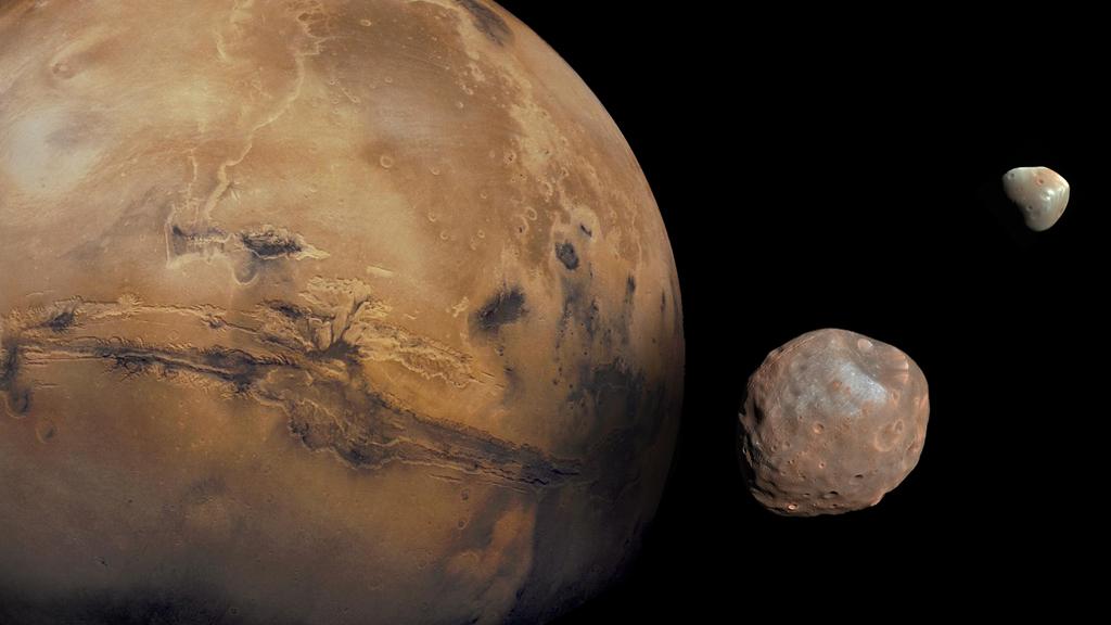 Mars has two moons: Phobos and Deimos. Phobos is 13.8 miles across, and Deimos is 7.8 miles across.