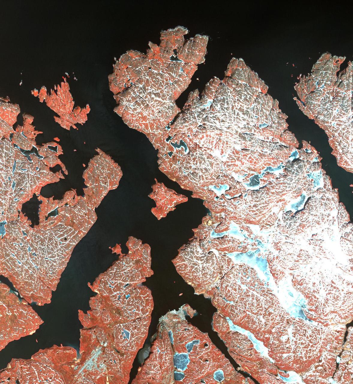 This image from NASA Terra spacecraft shows the town of Kirkenes in northernmost Norway, with its 3400 inhabitants, as they prepare for an expected boom as a shipping hub, as global warming has led to the opening up of the Northern Sea Route.