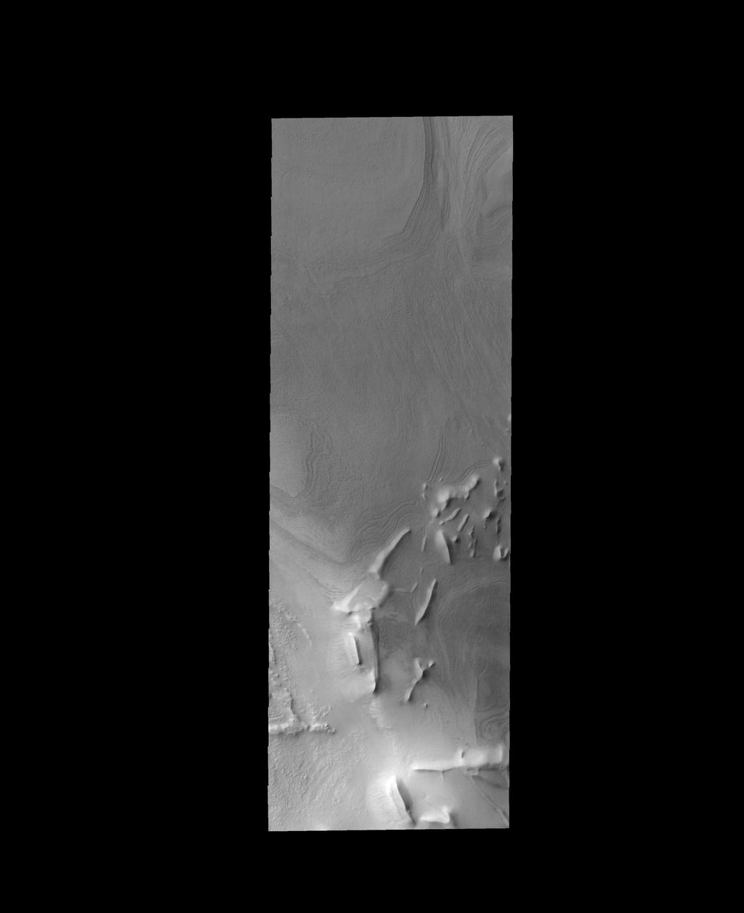 The linear ridges in this image captured by NASA 2001 Mars Odyssey spacecraft are located near the south polar cap.