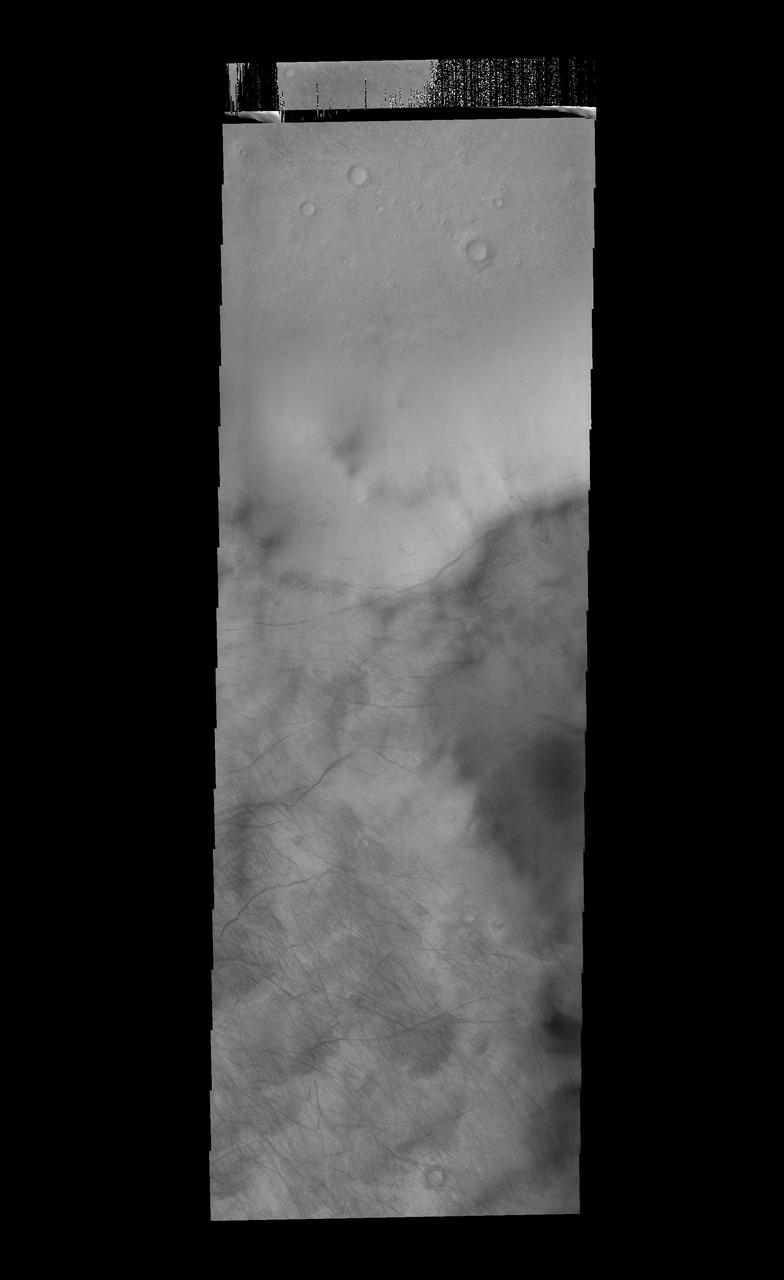 This image captured by NASA 2001 Mars Odyssey spacecraft show the tracks of dust devils on the rim of Stoney Crater.