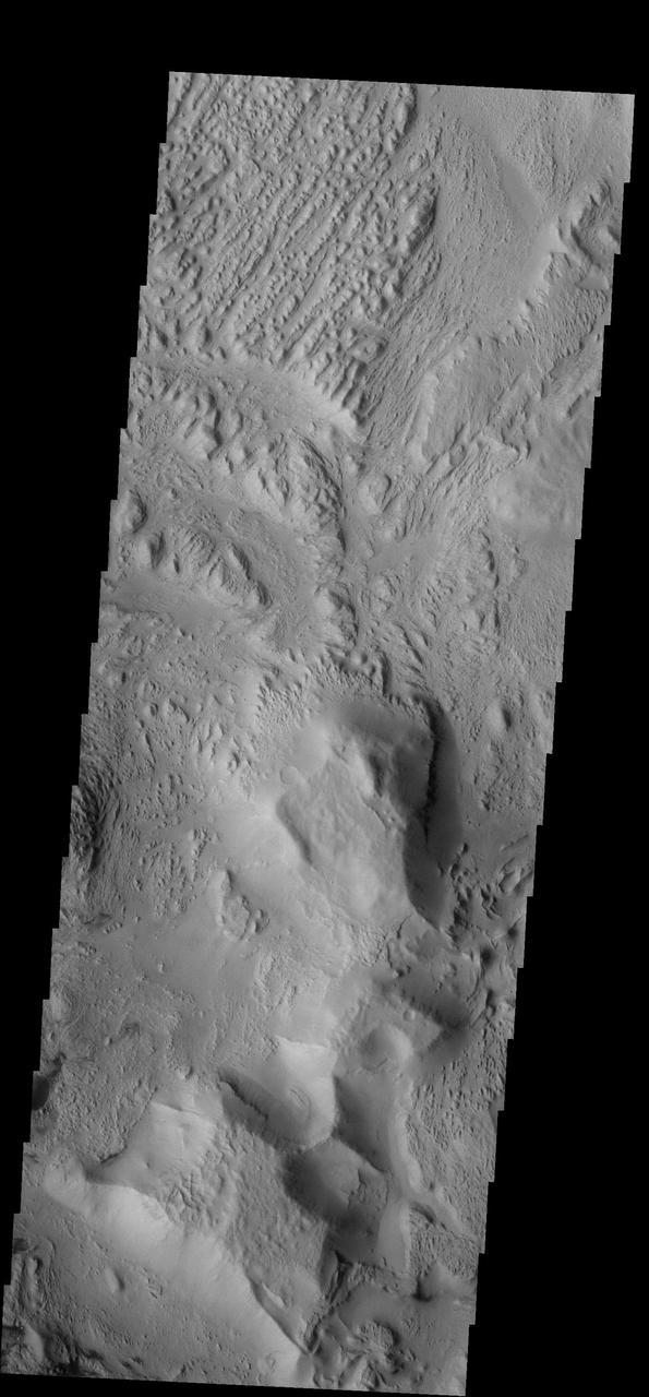 The wind is responsible for the erosion seen in this image captured by NASA 2001 Mars Odyssey spacecraft near Aeolis Planum.