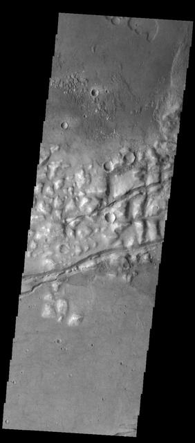 Several fractures cross through Gorgonum Chaos in this image captured by NASA 2001 Mars Odyssey spacecraft.