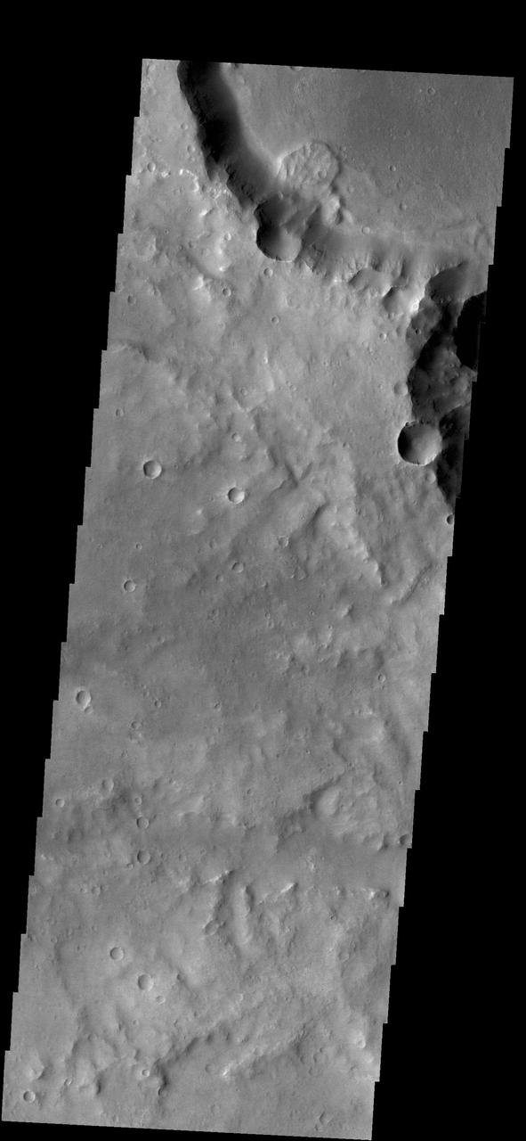 This small landslide deposit is located in an unnamed crater in Margaritifer Terra in this image captured by NASA 2001 Mars Odyssey spacecraft.