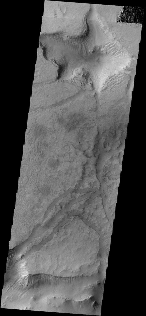 This image from NASA 2001 Mars Odyssey spacecraft shows some of the depressions in the material that fills Asimov Crater.