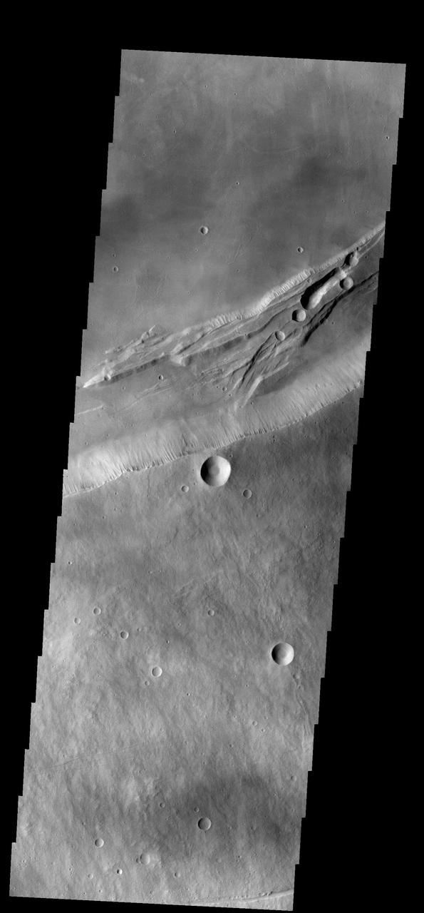 This image from NASA 2001 Mars Odyssey spacecraft shows part of the summit caldera on Arsia Mons.