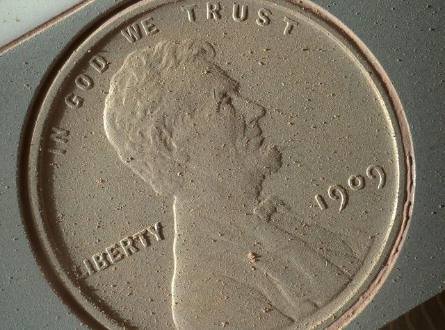 This image of a U.S. penny on a calibration target was taken by the Mars Hand Lens Imager MAHLI aboard NASA Curiosity rover in Gale Crater on Mars. At 14 micrometers per pixel, this is the highest-resolution image that MAHLI can acquire.