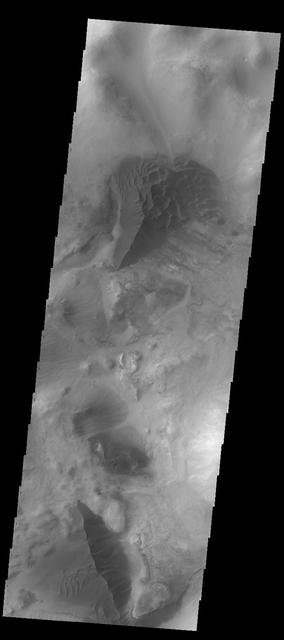 The large hills of sand in this image from NASA 2001 Mars Odyssey spacecraft are located on western margin of Argyre Planitia.