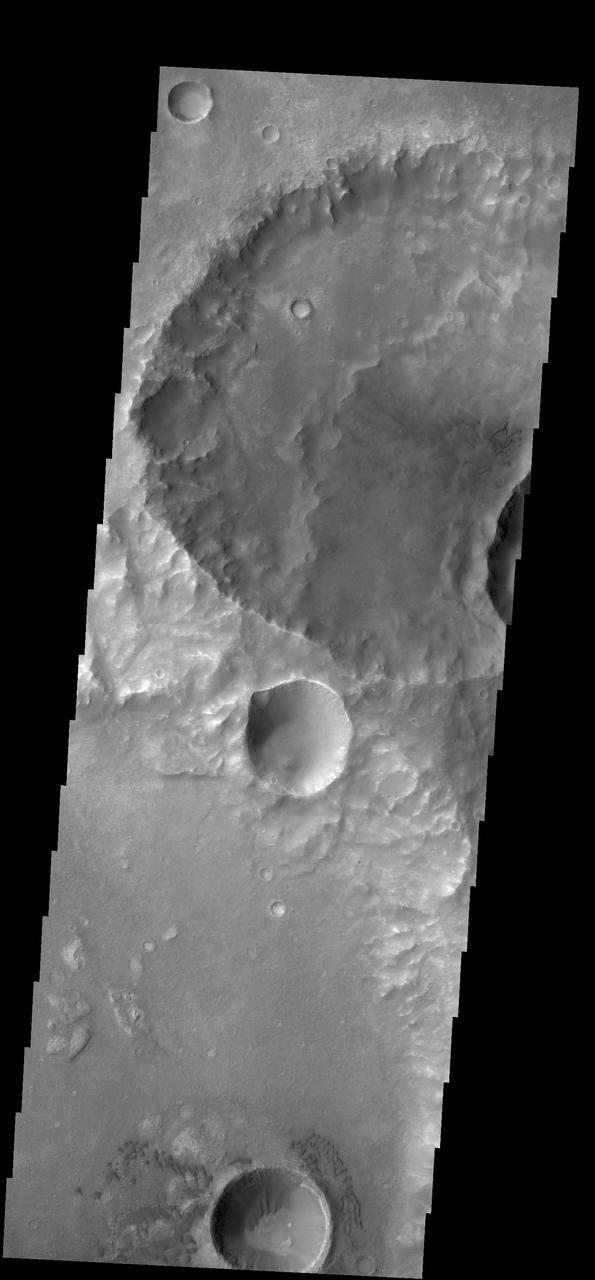 Dunes can be seen in the bottom and upper right central parts this image of Terra Cimmeria captured by NASA 2001 Mars Odyssey spacecraft.