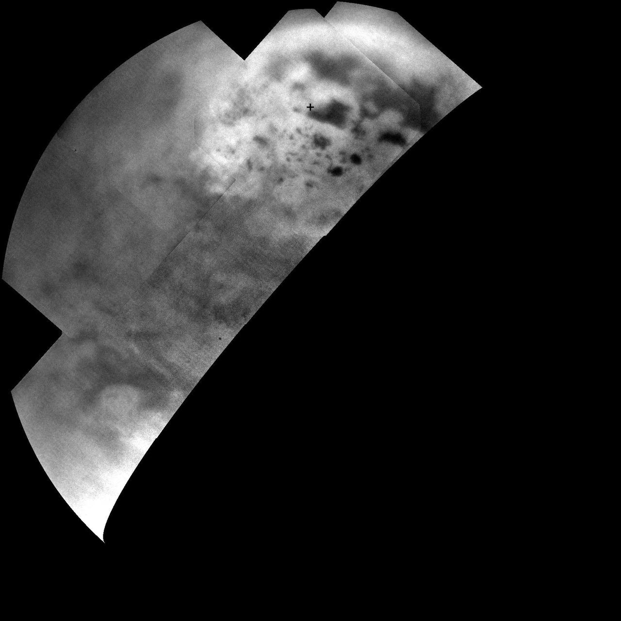 Ultracold hydrocarbon lakes and seas dark shapes near the north pole of Saturn moon Titan can be seen embedded in some kind of bright surface material in this infrared mosaic from NASA Cassini mission.