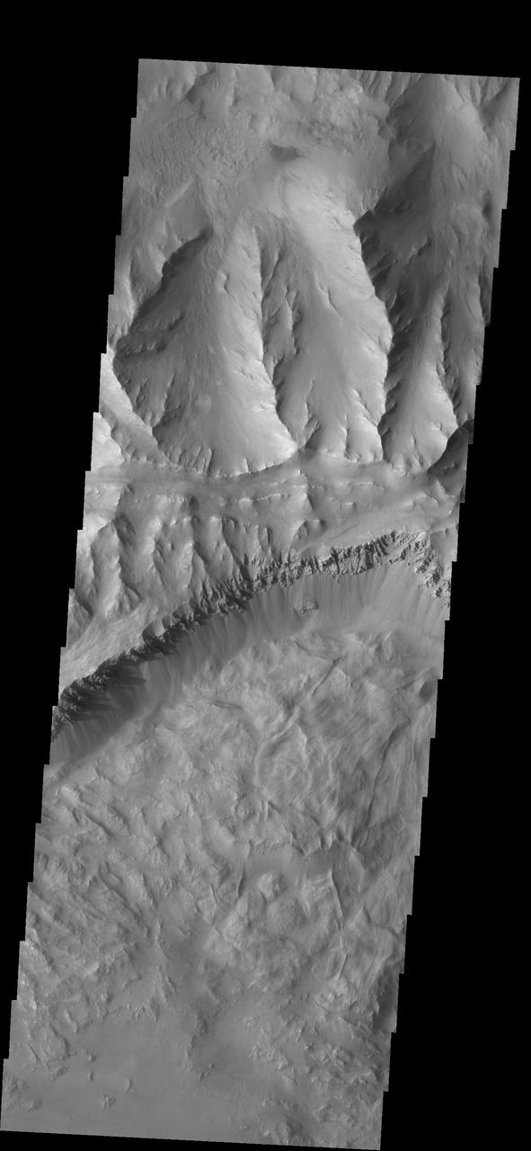 This image from NASA 2001 Mars Odyssey spacecraft shows part of Coprates Chasma, which is just one part of the extensive Valles Marineris canyon system.