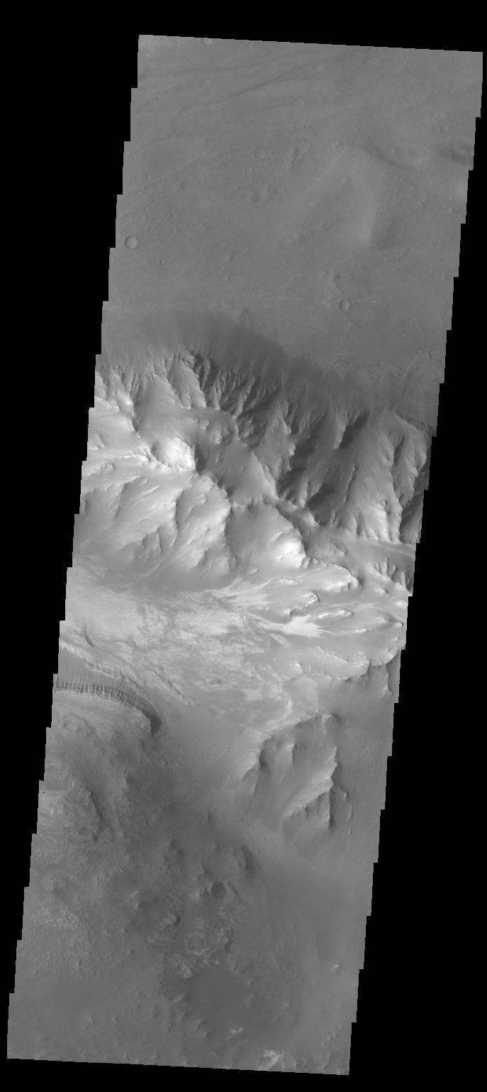 This image captured by NASA 2001 Mars Odyssey spacecraft is further west from yesterday image, near the margin between Coprates Chasma and Melas Chasma.