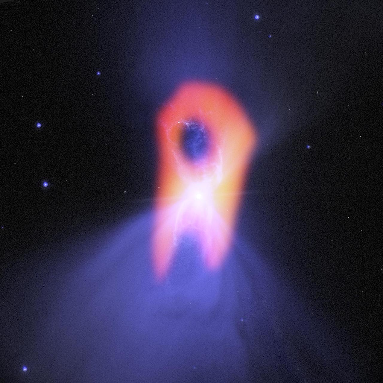 The Boomerang nebula, called the coldest place in the universe, reveals its true shape to the Atacama Large Millimeter/submillimeter Array ALMA telescope. The background blue structure, is seen in visible light by NASA Hubble Space Telescope.