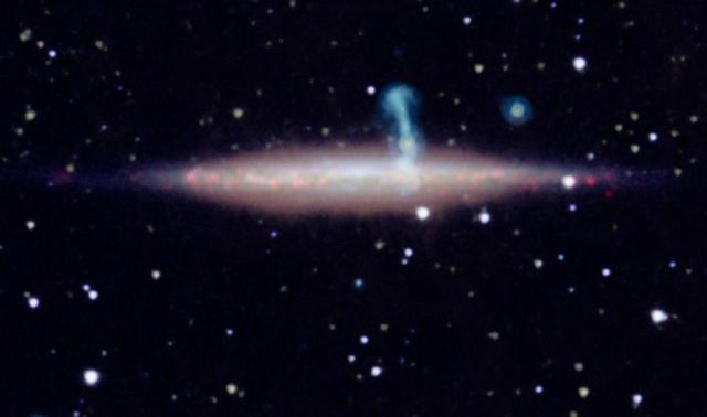 New detailed radio data from the NRAO Jansky Very Large Array VLA revealed that the large perpendicular extension of UGC 10288 halo blue is really a distant background galaxy with radio jets.