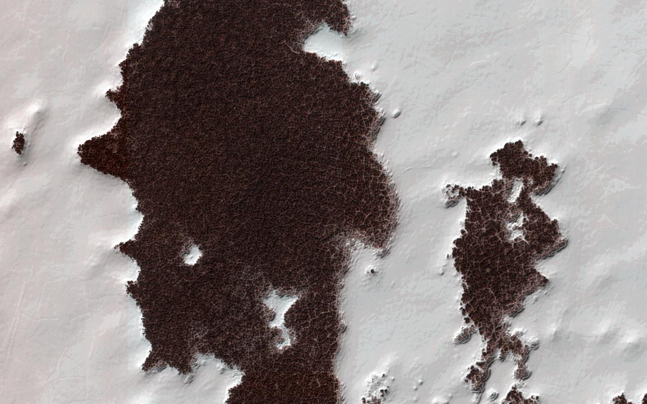 The white portions of this observation are part of the South Polar residual ice cap, with the sunlight is coming from roughly the bottom of this non-map projected image captured by NASA Mars Reconnaissance Orbiter.
