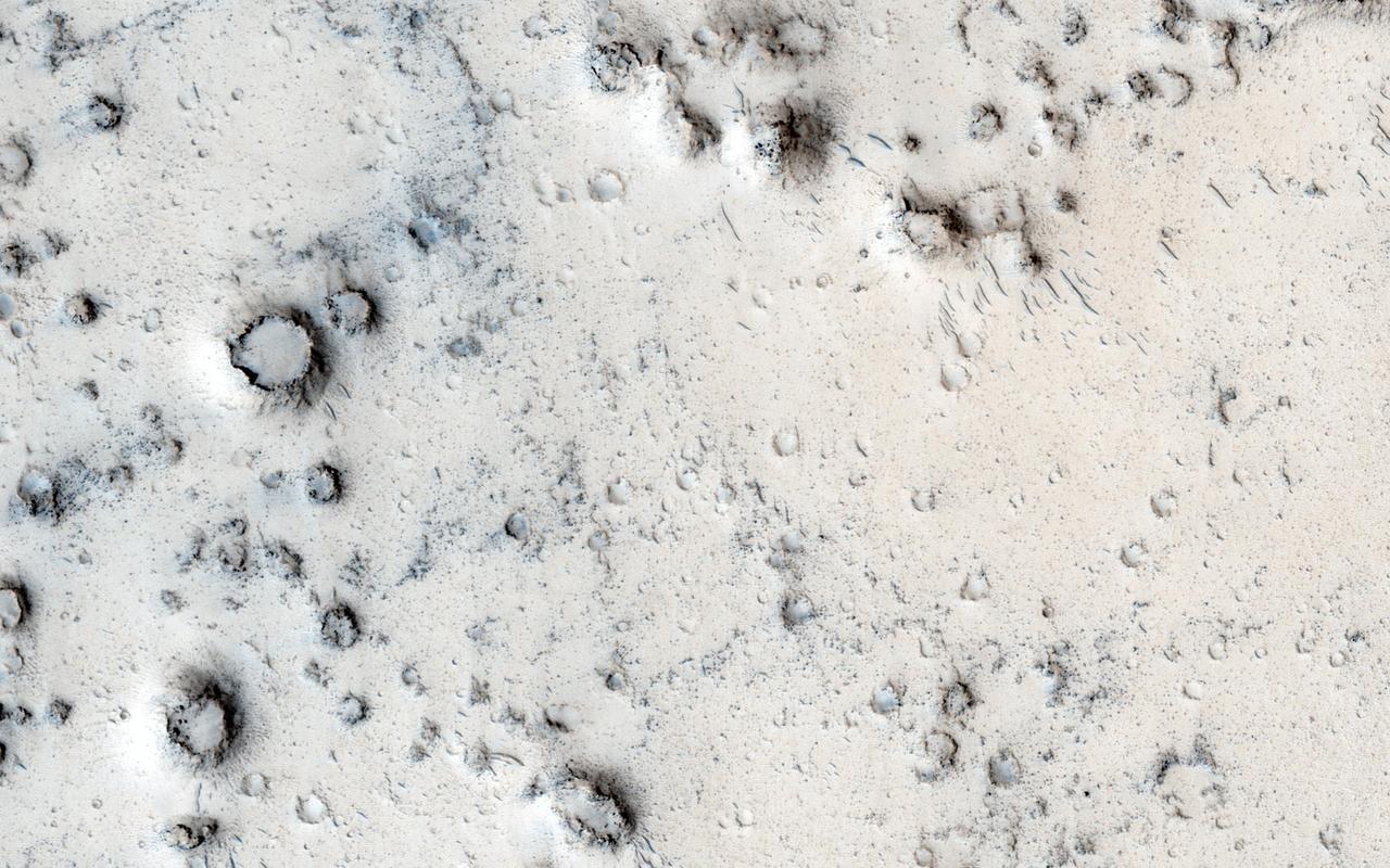 Many types of craters exist on Mars. Most are generated by impacts of asteroids and comets. However, in this image captured by NASA Mars Reconnaissance Orbiter, the craters may be due to steam explosions.