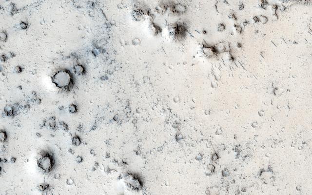 NASA image: Cratered Cones in Tartarus Montes