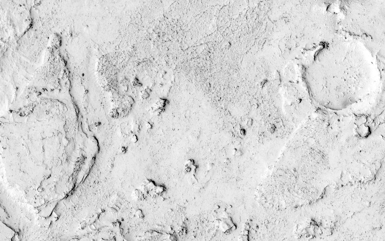 This observation from NASA Mars Reconnaissance Orbiter shows the end of a small channel near Athabasca Valles on Mars. Athabasca is an example of a Martian outflow channel, likely carved by a massive flood of groundwater.