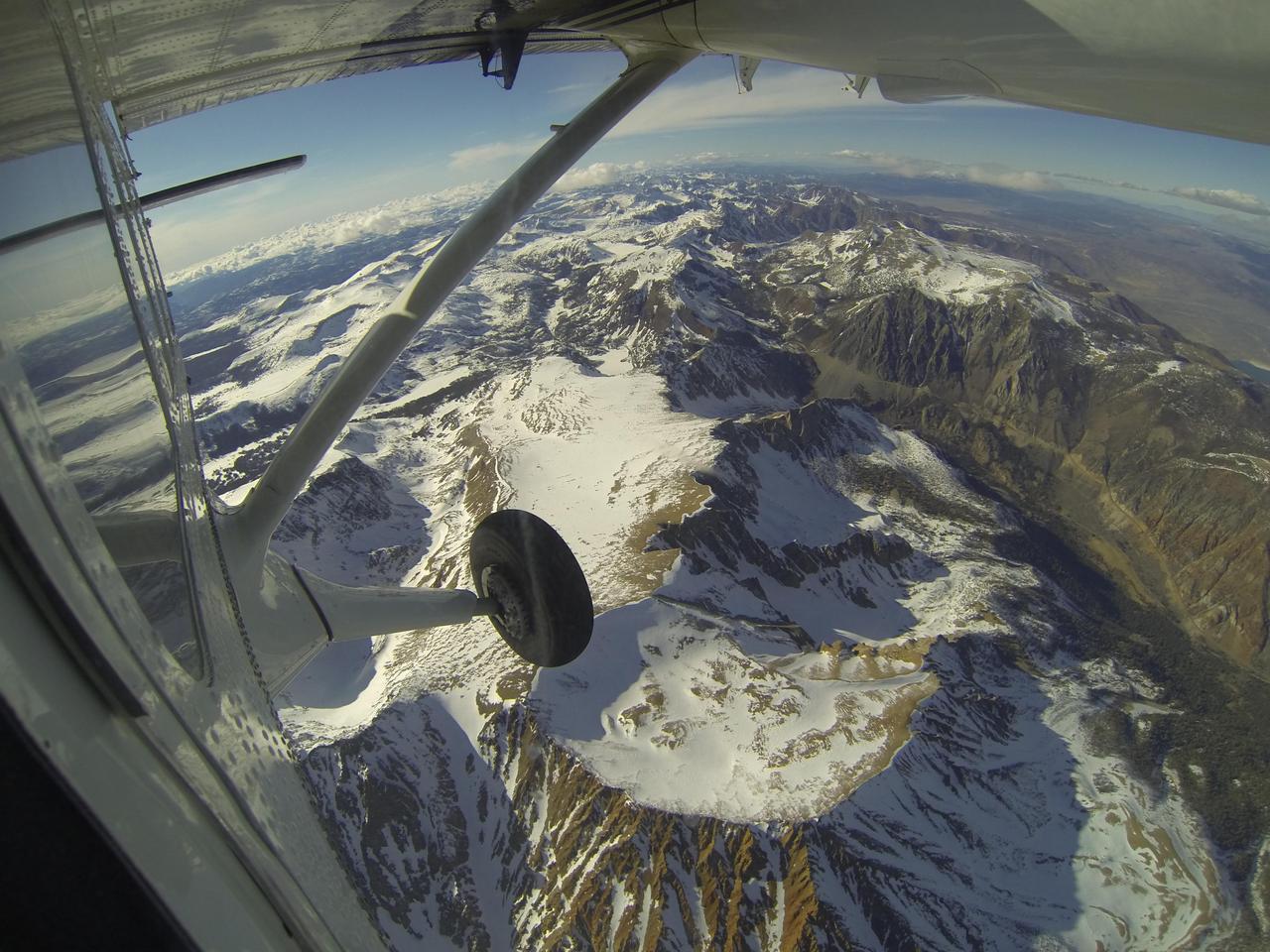 Mt. Dana and Dana Plateau in the Tuolumne River Basin within Yosemite National Park, Calif., as seen out the window of a Twin Otter aircraft carrying NASA Airborne Snow Observatory on April 3, 2013.