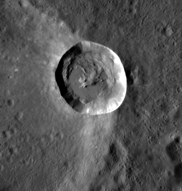 The steep northern wall of Tithonium Chasma crosses this image from NASA 2001 Mars Odyssey spacecraft. Landslide deposits from slope failure can be seen at the lower left corner of the image.