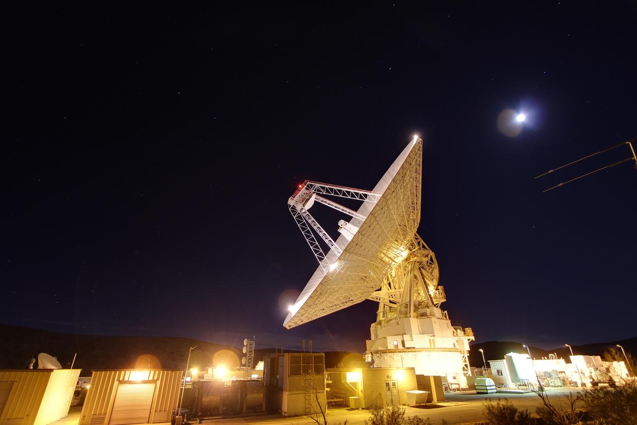 Late night in the desert: Goldstone 230-foot 70-meter antenna tracks spacecraft day and night. This photograph was taken on Jan. 11, 2012. The Goldstone Deep Space Communications Complex is located in the Mojave Desert in California, USA.
