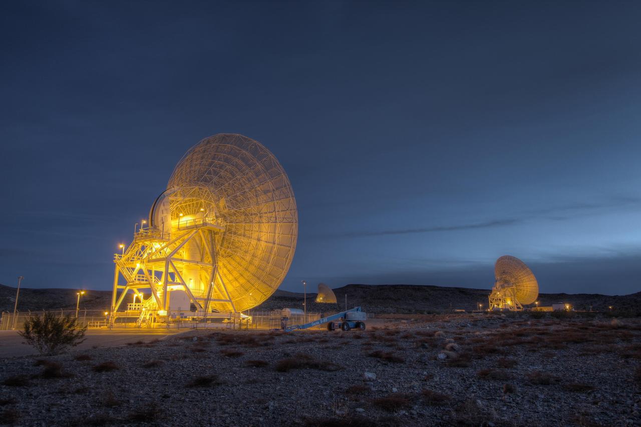 Beam Wave Guide antennas at Goldstone, known as the Beam Waveguide Cluster. They are located in an area at Goldstone called Apollo Valley. The Goldstone Deep Space Communications Complex is located in the Mojave Desert in California, USA.