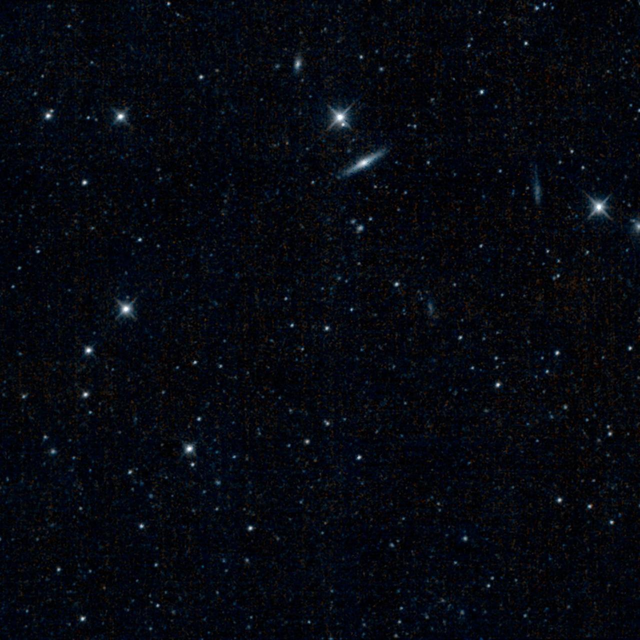 This is one of the first images captured by the revived NEOWISE mission, after more than two years of hibernation. It shows a patch of sky in the constellation Canes Venatici, or the Hunting Dogs.