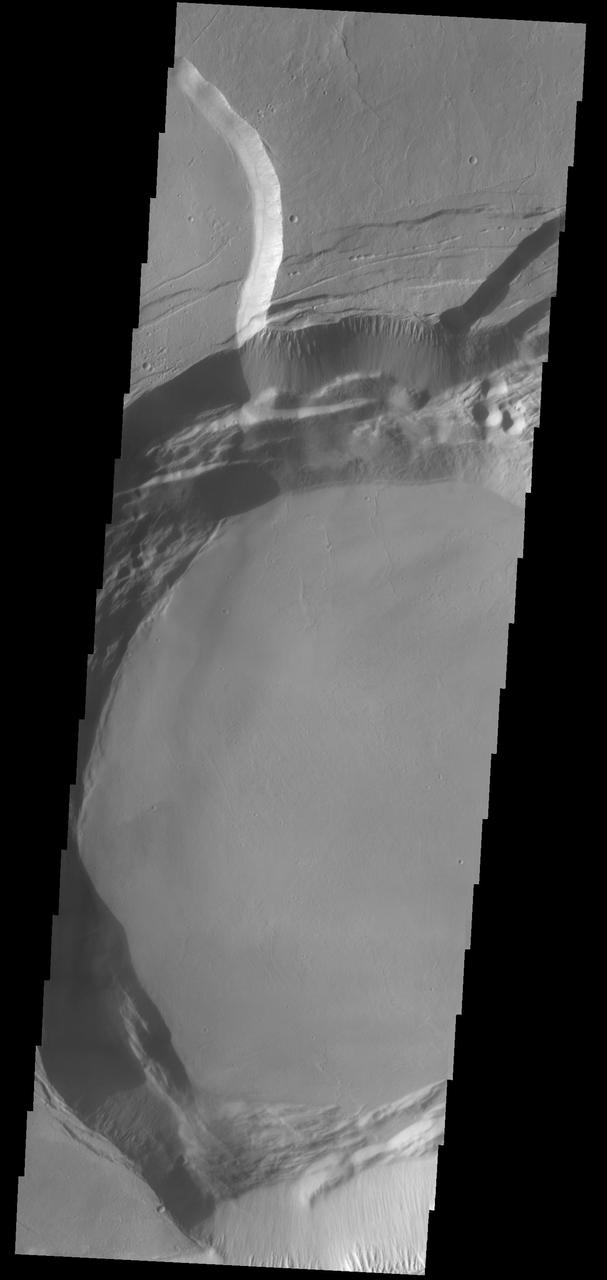 This image captured by NASA 2001 Mars Odyssey spacecraft shows part of the summit caldera of Ascraeus Mons.