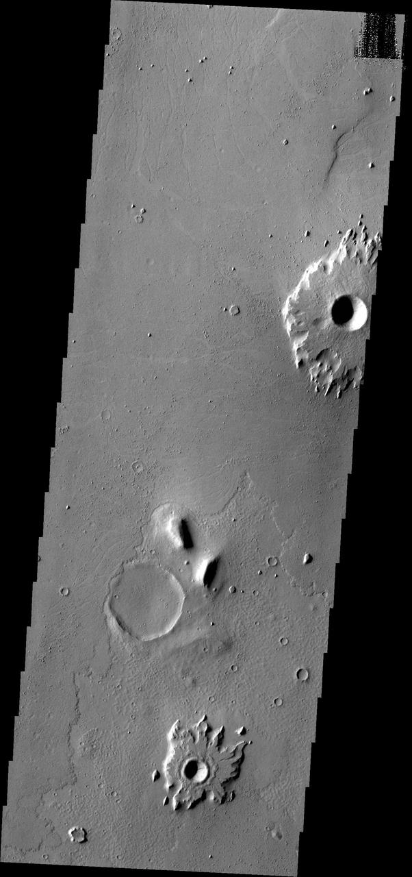 The southern Amazonis Planitia shows two craters with ejecta that stand out above the surrounding surface. The ejecta has remained in place while the surrounding material was removed. This image is from NASA 2001 Mars Odyssey spacecraft.
