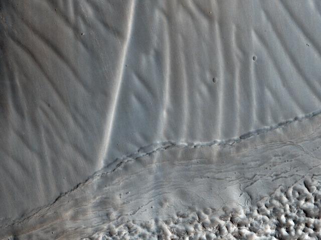 NASA image: Rippled Surfaces on a Slope in Coloe Fossae