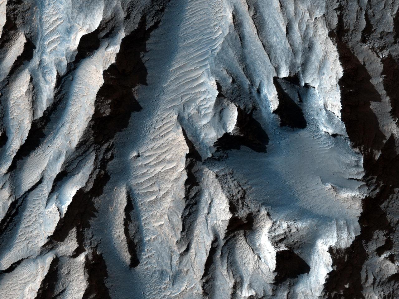 This observation from NASA Mars Reconnaissance Orbiter is of an east-facing slope in Tithonium Chasma.