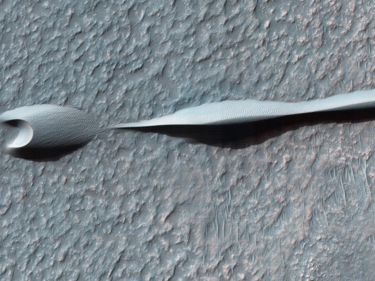 Sand dunes like those seen in this image from NASA Mars Reconnaissance Orbiter have been observed to creep slowly across the surface of Mars through the action of the wind.