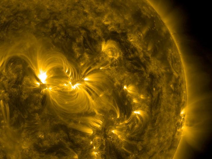 One broad active region sported a wonderful example of coiled magnetic field lines over almost a four-day period (July 15-18, 2016). The magnetic lines are easily visible in this 171 Angstrom wavelength of extreme ultraviolet light be cause charged particles are spiraling along the lines. The active region is a hotbed of struggling magnetic forces that were pushing out above the sun's surface.  http://photojournal.jpl.nasa.gov/catalog/PIA17911