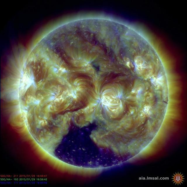 A large, dark coronal hole at the bottom of the Sun has been the most dominant feature this week Jan. 29, 2014 as seen by NASA GSFC Solar Dynamics Observatory.