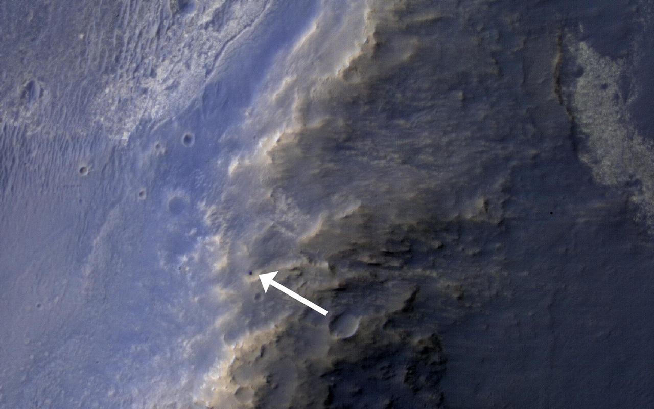 This HiRISE image of the Opportunity rover was acquired as a coordinated ride-along observation with the CRISM instrument, also onboard the Mars Reconnaissance Orbiter.