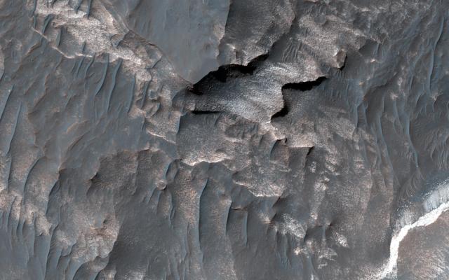 NASA image: Light-Toned Deposits along Coprates Chasma Slopes