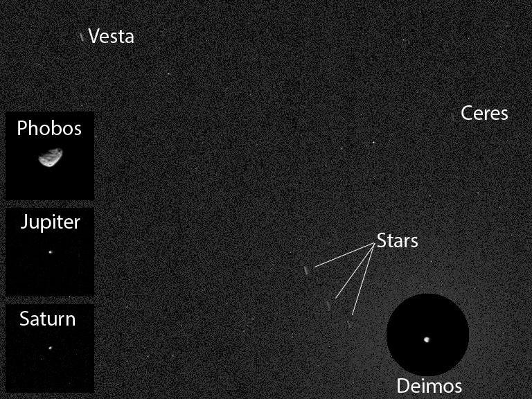 NASA Curiosity Mars rover has caught the first image of asteroids taken from the surface of Mars. The image includes two asteroids, Ceres and Vesta. This version includes Mars moon Deimos.