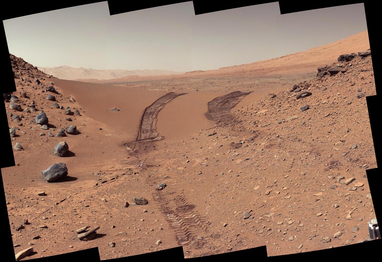 This look back at a dune that NASA Curiosity Mars rover drove across was taken by the rover Mast Camera Mastcam during the 538th Martian day, or sol, of Curiosity work on Mars Feb. 9, 2014.
