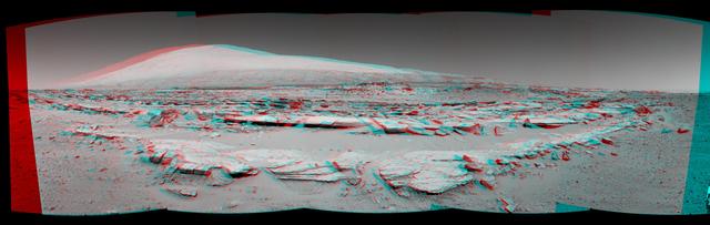 A stereo landscape scene from NASA Curiosity Mars rover shows rock rows at Junda forming striations in the foreground, with Mount Sharp on the horizon. You need 3D glasses to view this image.