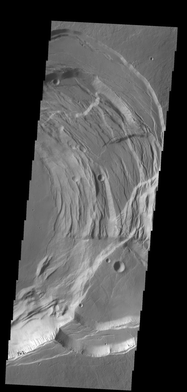This image captured by NASA 2001 Mars Odyssey spacecraft shows the eastern part of the complex caldera at the summit of Ascraeus Mons.