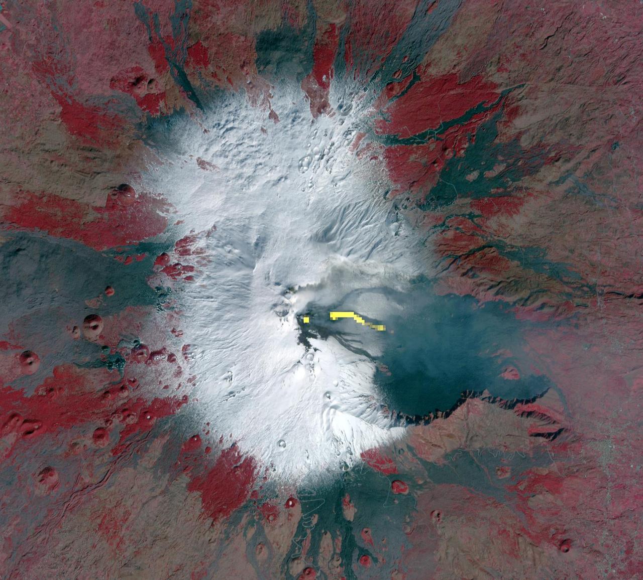 This image acquired by NASA Terra spacecraft is of Mt. Etna, Europe most active volcano, as it continued its latest eruptive activity with a new lava flow from the recently formed southeast crater.
