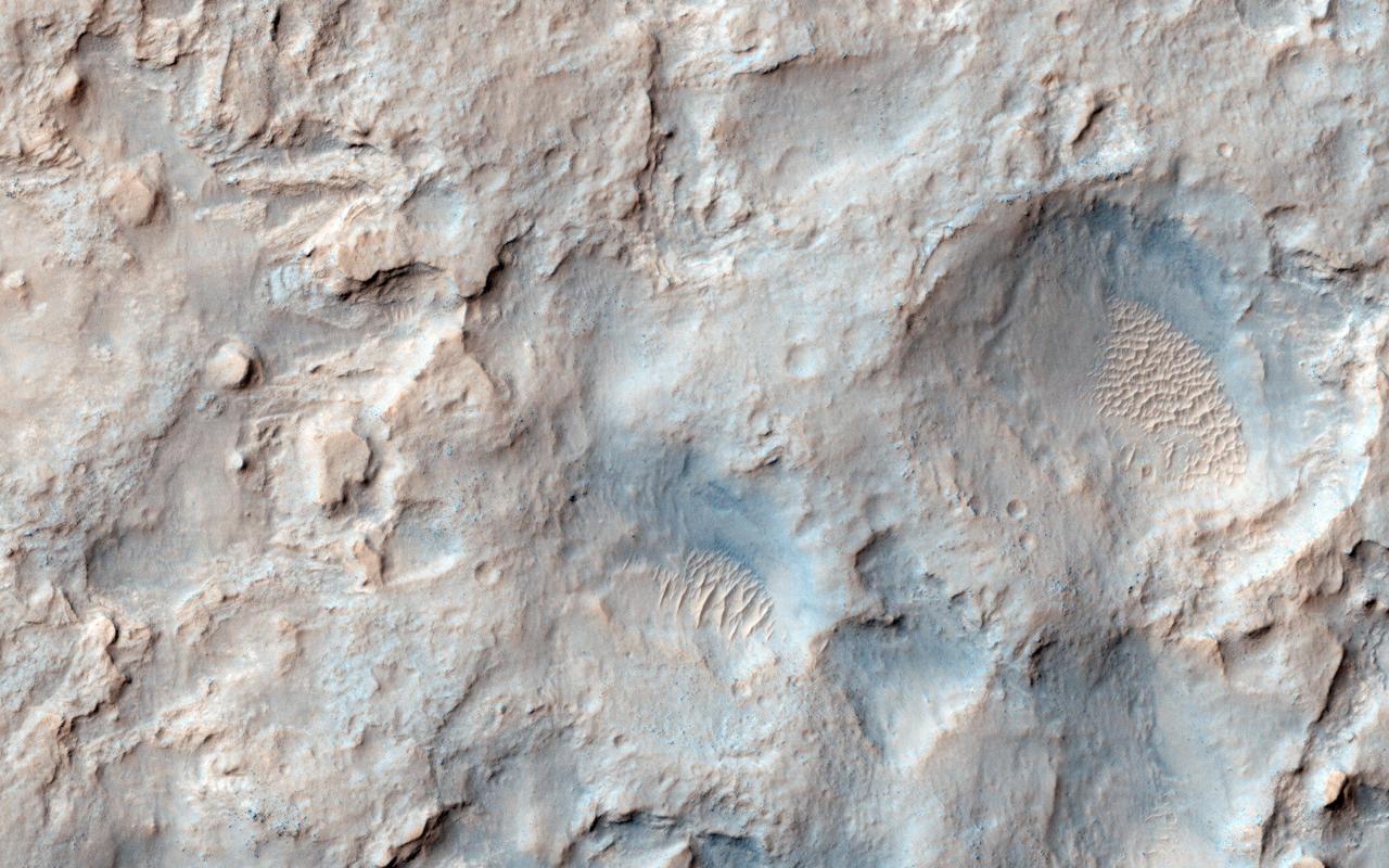 NASA Mars Reconnaissance Orbiter saw the saddle between two valleys named Dingo Gap-in Gale Crater-where the rover Curiosity just traversed. The gap is spanned by a single dune visible both from the ground and from orbit.
