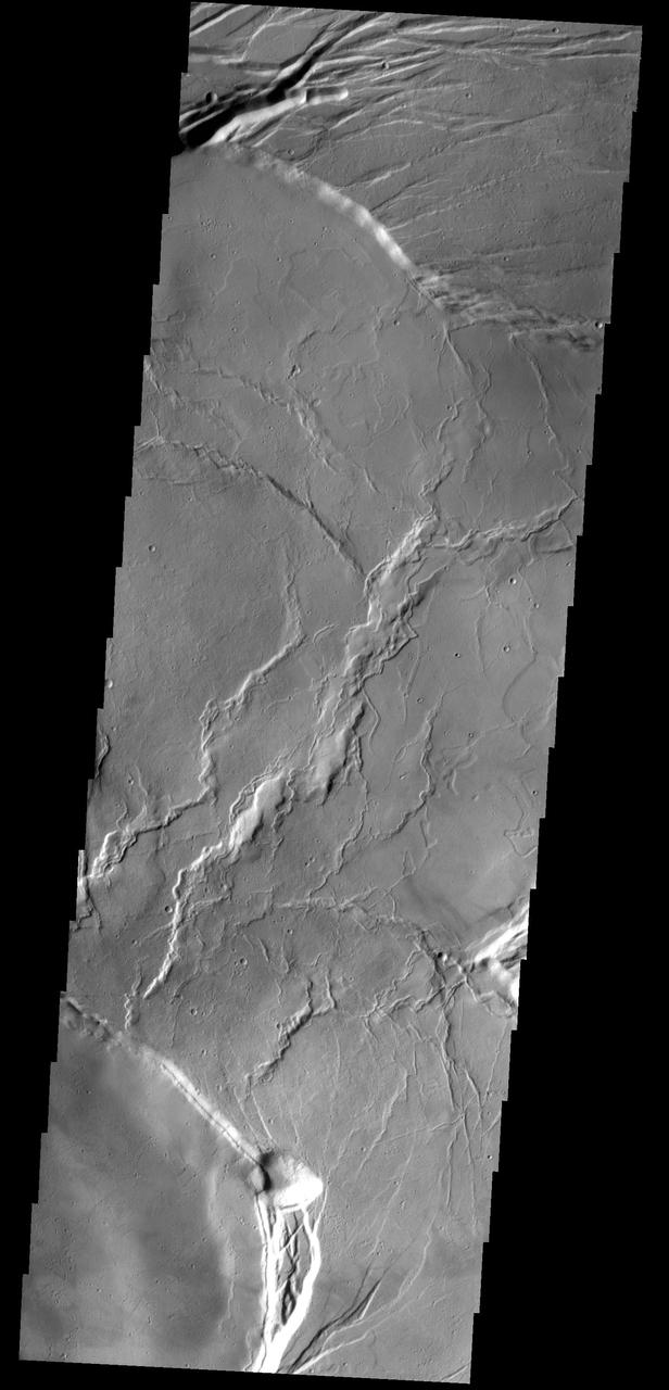 This image from NASA 2001 Mars Odyssey shows the central portion of the complex caldera at the summit of Olympus Mons.