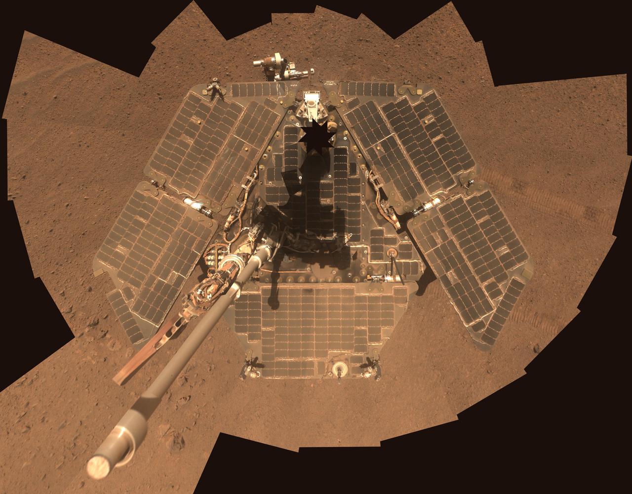 A self-portrait of NASA Mars Exploration Rover Opportunity taken by the rover panoramic camera Pancam in late March 2014 shows effects of recent winds removing much of the dust from the rover solar arrays.
