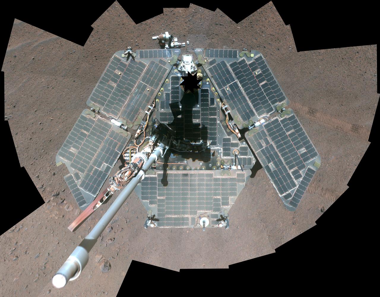 A false-color self-portrait of NASA Mars Exploration Rover Opportunity taken by the rover panoramic camera Pancam shows effects of recent winds removing much of the dust from the solar arrays.