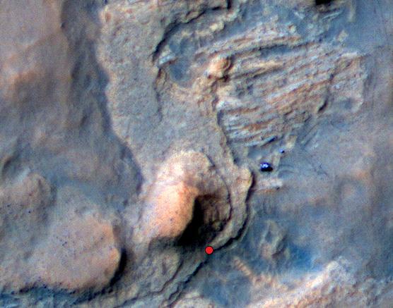 In this Mars Reconnaissance Orbiter view of the Curiosity rover mission waypoint called the Kimberley, the red dot indicates the location of a sandstone target, Windjana, selected for close-up inspection.