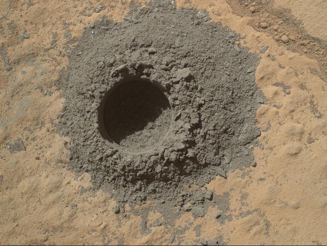 NASA Curiosity Mars rover completed a shallow mini drill test April 29, 2014, in preparation for full-depth drilling at a rock target called Windjana. The hole results from the test is 0.63 inch across and about 0.8 inch deep.