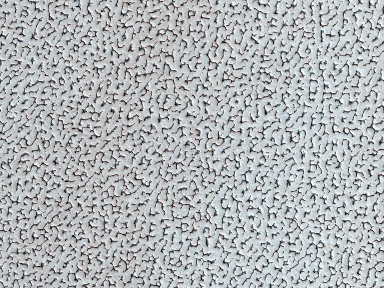 A bright ice cap of frozen water covers the North Pole of Mars as seen by NASA Mars Reconnaissance Orbiter. In winter, thin coverings of carbon dioxide and water frost covers this area and frosts finally disappear at end of the Martian spring season.