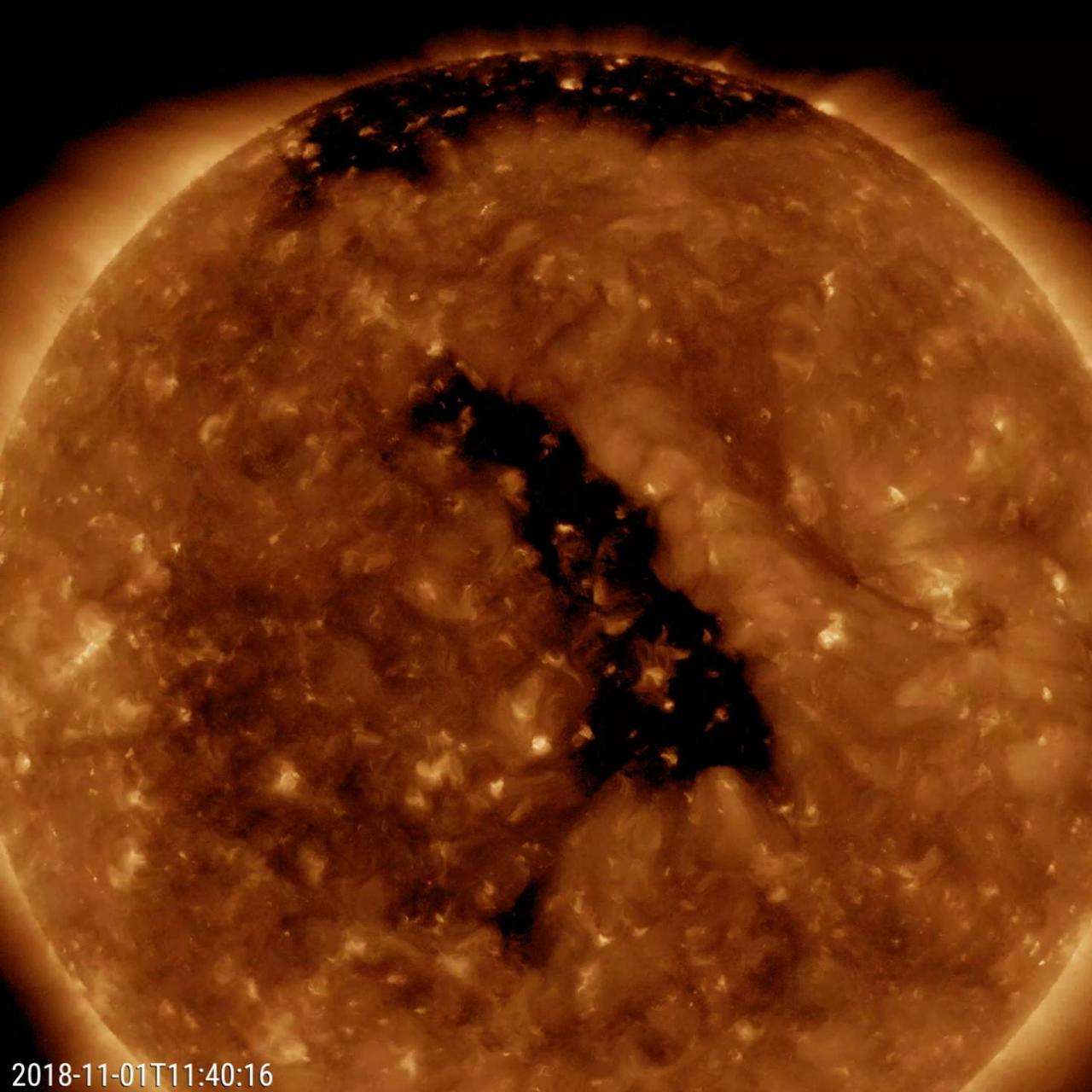The most distinctive feature on the Sun this week was a good-sized coronal hole at a slanted angle nearly centered on the face of the sun (Oct. 31 - Nov. 2, 2018). Coronal holes are magnetically open areas from which solar wind particles speed into space. They appear darker in this wavelength of extreme ultraviolet light. If these particles impact Earth's magnetosphere, they will likely generate aurora near the Earth's poles regions. The video clip covers about two days of activity. Movies available at https://photojournal.jpl.nasa.gov/catalog/PIA18141