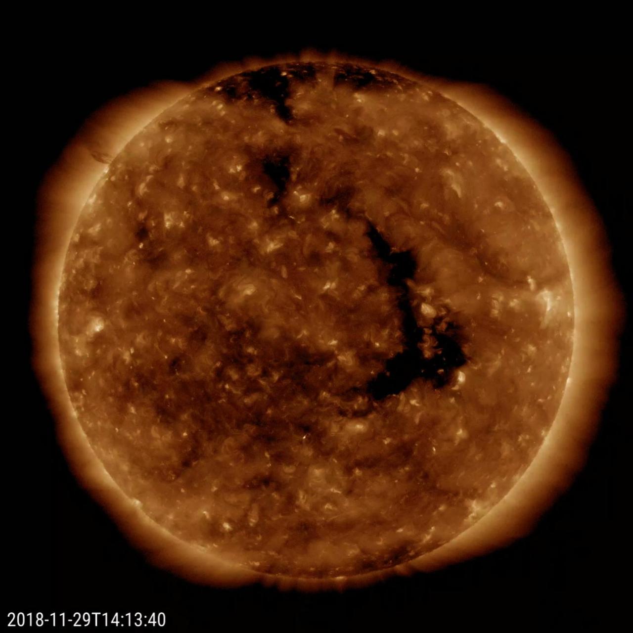 A long-lasting coronal hole has again rotated around to face the Earth (Nov. 28-30, 2018). This persistent hole - the elongated dark region seen in the still image - first appeared in July and has been observed each rotation of the Sun since. Coronal holes are the source of high-speed solar wind; when this one faced Earth, it sparked outbursts of aurora some of which were observed in our northern tier states. Coronal holes are magnetically open regions on the Sun that can last from days to months, although this one has lasted longer than most. The time-lapse video, taken in a wavelength of extreme ultraviolet light, covers about two days of activity. Movies available at https://photojournal.jpl.nasa.gov/catalog/PIA18144